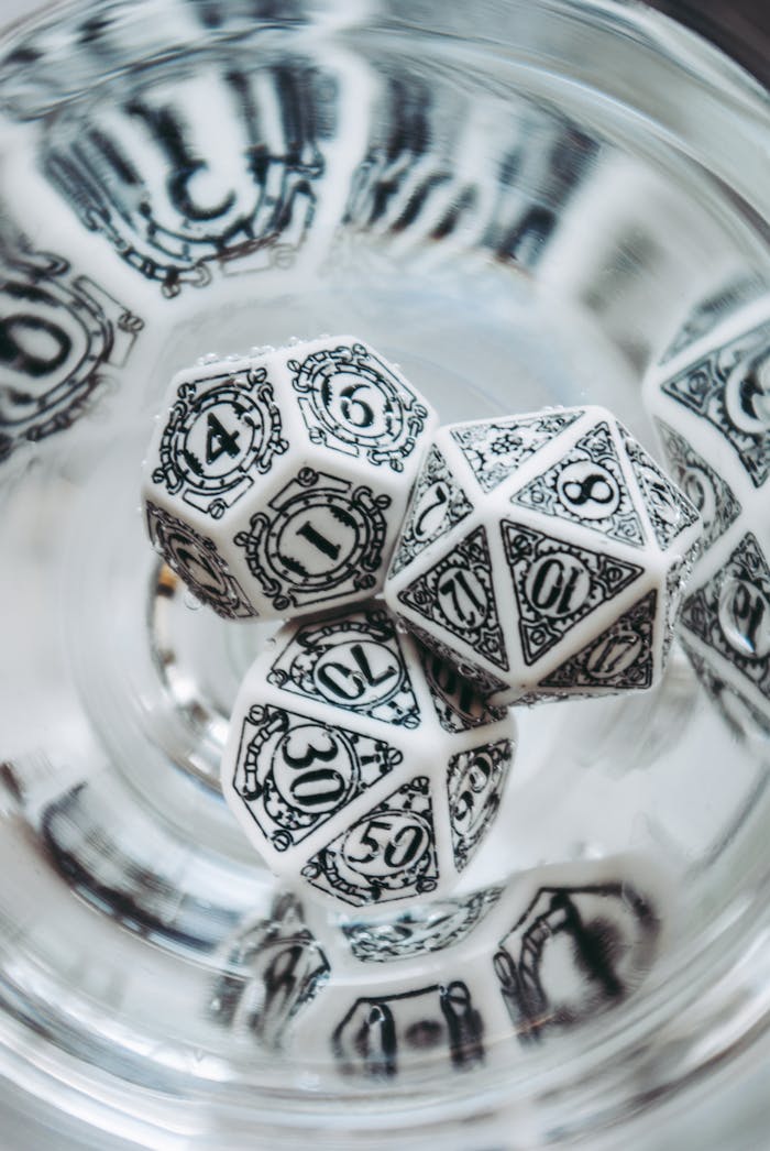 Artistic close-up of ornate dice used in Dungeons & Dragons, highlighting the intricate designs.